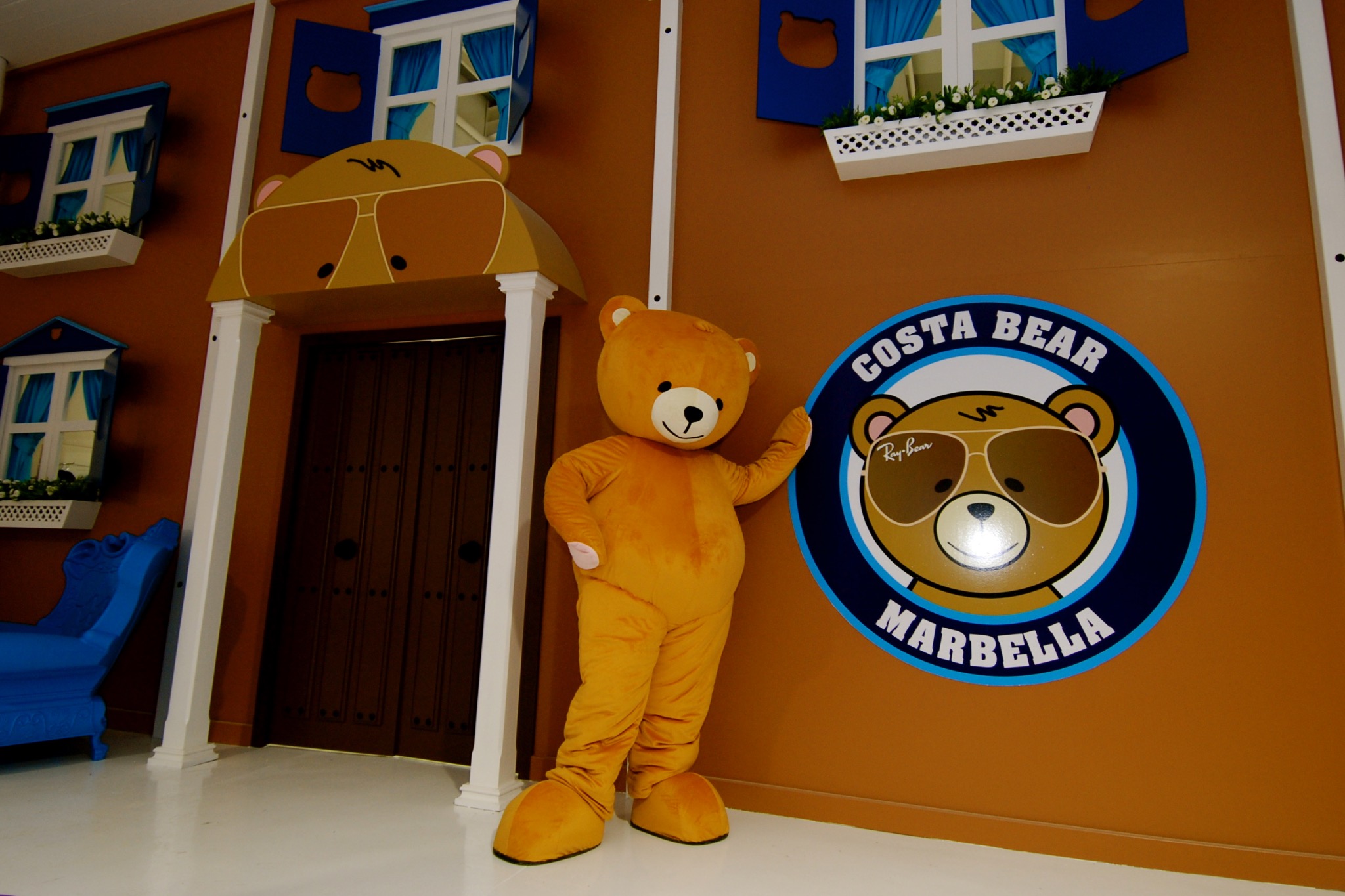 Costa Bear Marbella entrance with bear mascot and blue shutters