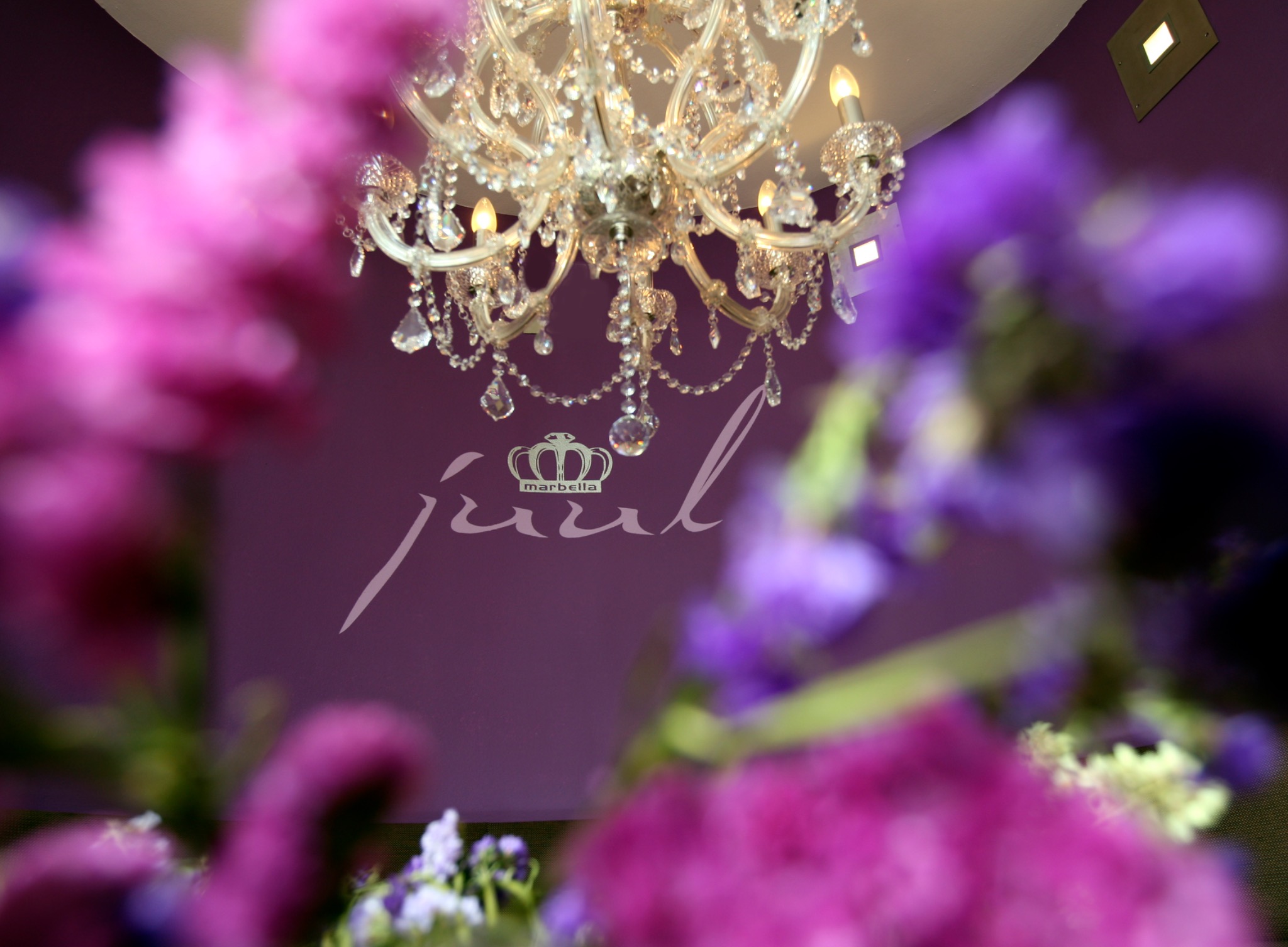 Crystal chandelier detail at Grand Café Juul in Marbella